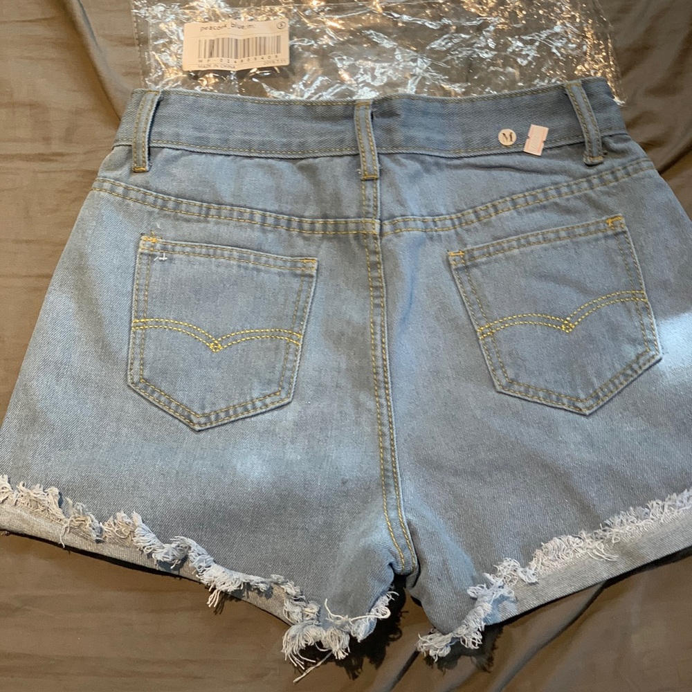 Peacock blue Jean shorts cuff roll with fringe